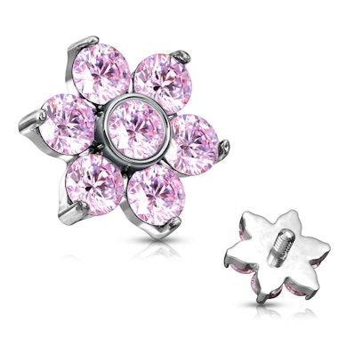 Dermal anchor met een bloem gevormd uit steentjes.