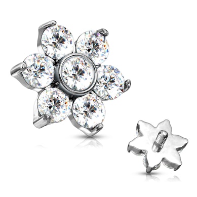 Dermal anchor met een bloem gevormd uit steentjes