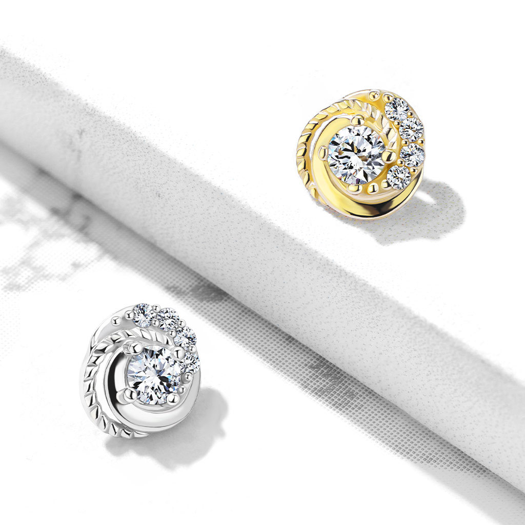 dermal uit 14 karaats goud met gevlochten patroon en steentjes