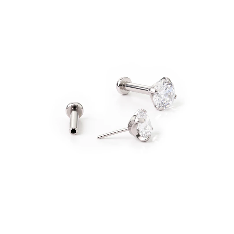 Titanium push-in labret met steentje in tandzetting