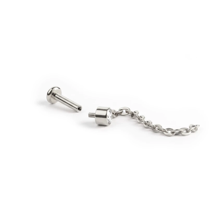 Sierlijke titanium labret met steentje en hangertje