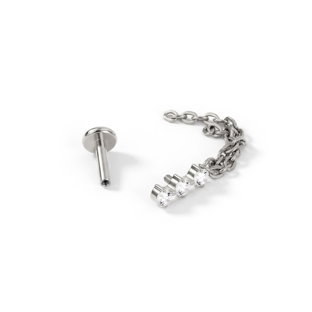Titanium labret met trio van steentjes en dubbel kettinkje