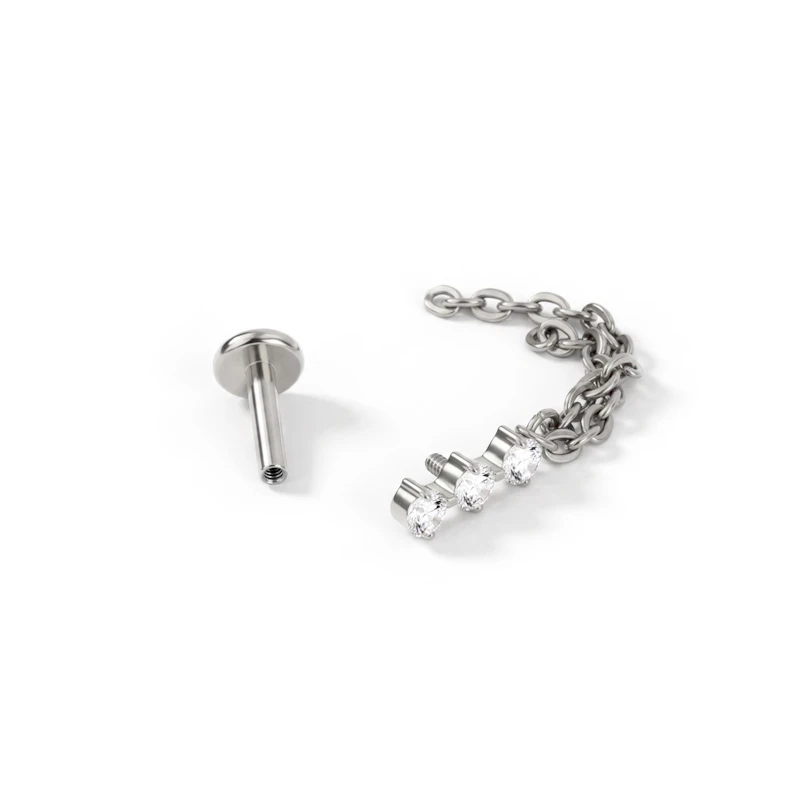 Titanium labret met trio van steentjes en dubbel kettinkje