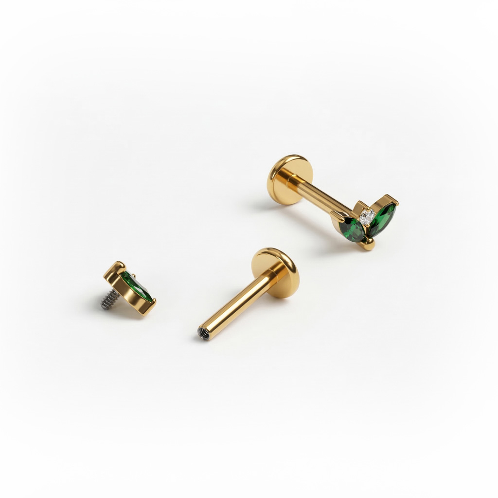 Titanium labret met paar smaragdkleurige stenen